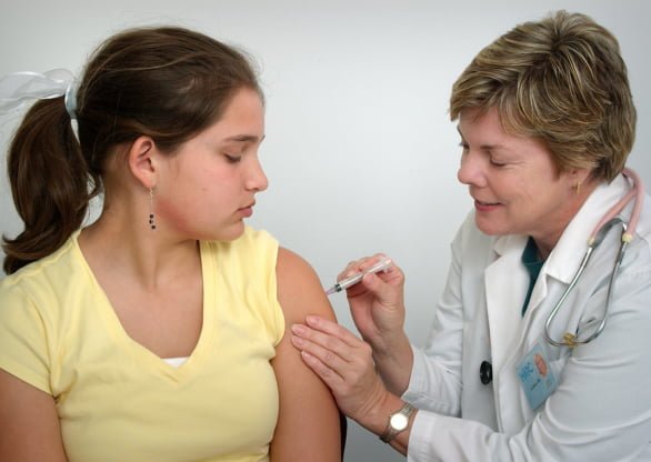 Girl receiving vaccination